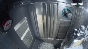 Animation of chip being removed from the machining center in the center trough